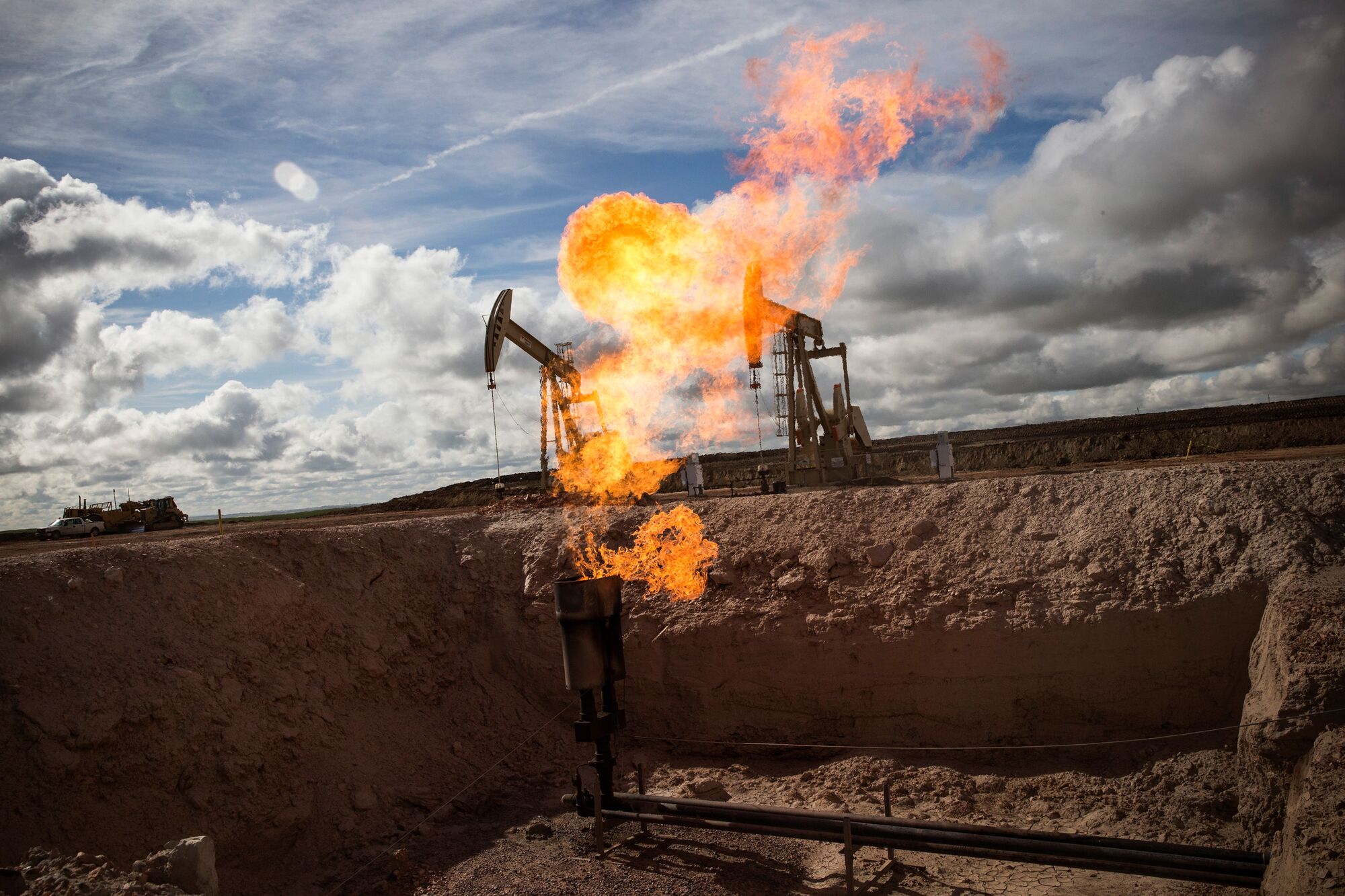 A gas flare is seen at an oil well site on July 26, 2013 outside Williston, North Dakota. (Andrew Burton/Getty Images)