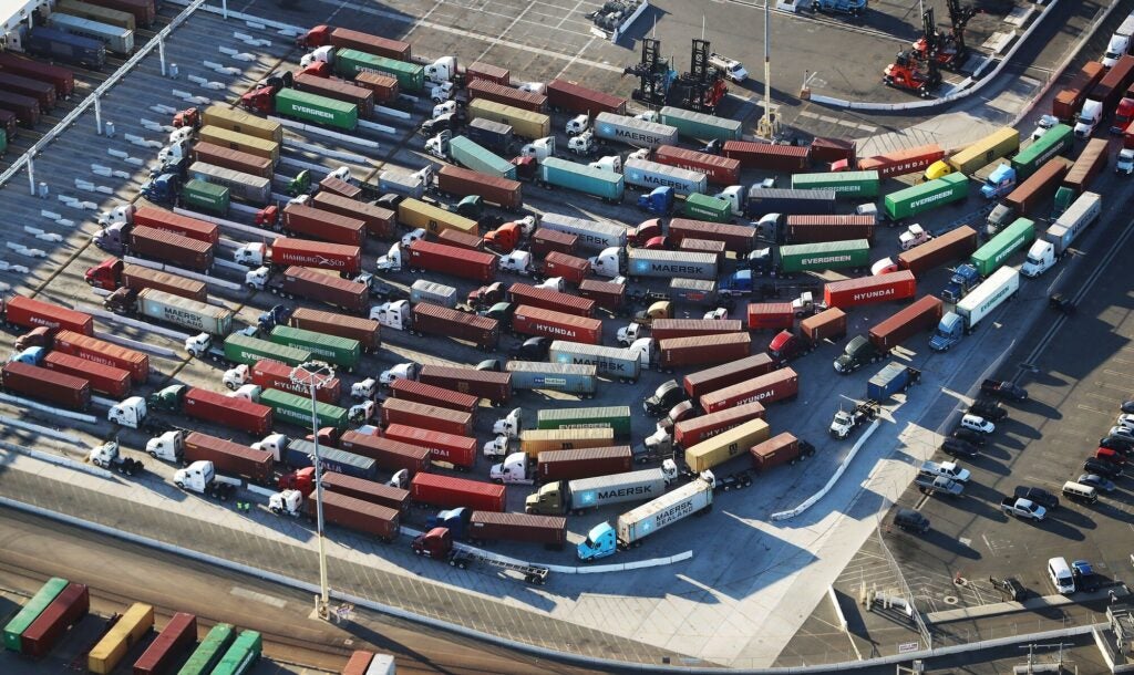An aerial view of shipping containers attached to trucks