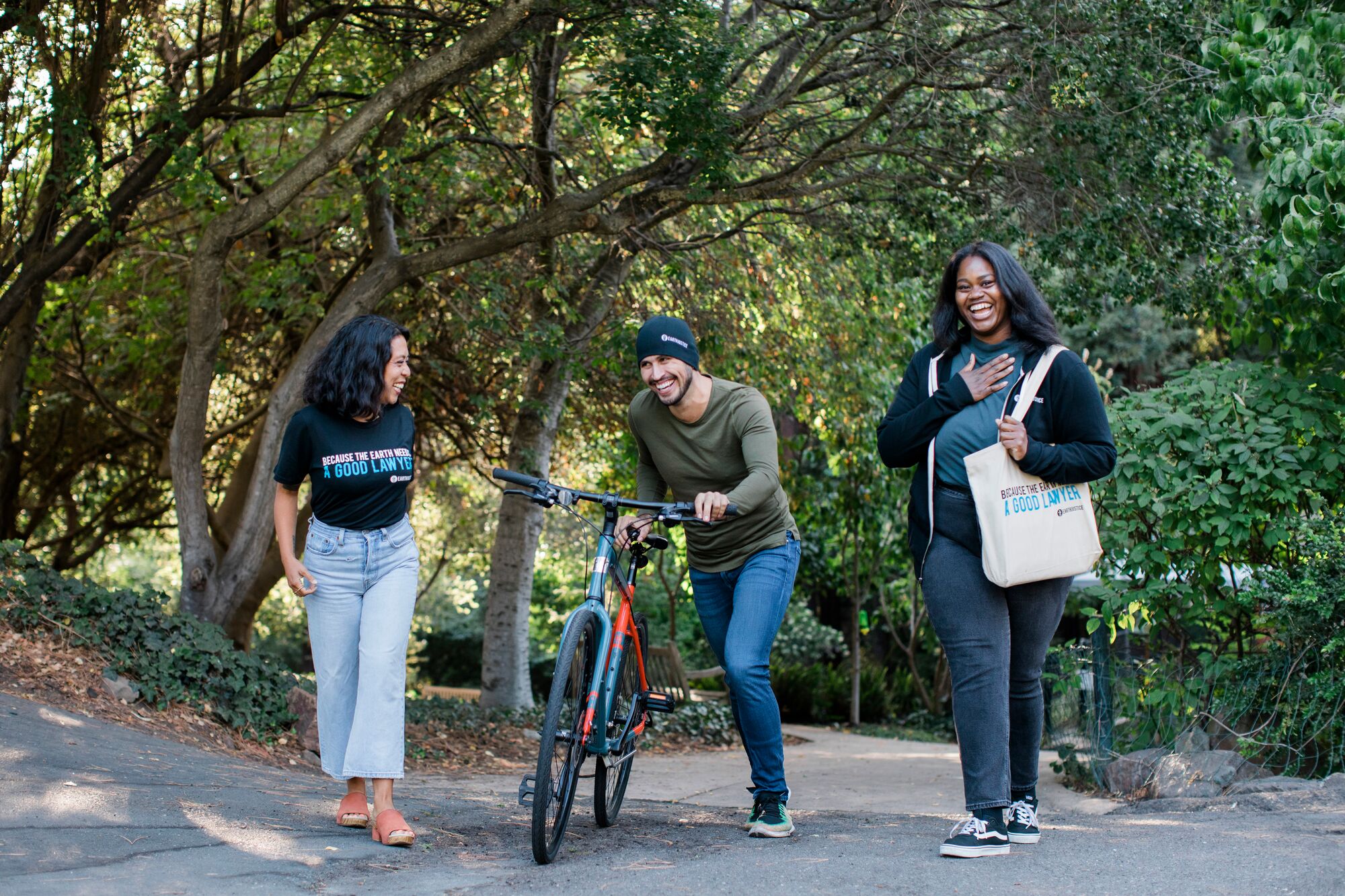 Earthjustice staff members walk through a park in Oakland, Calif.
