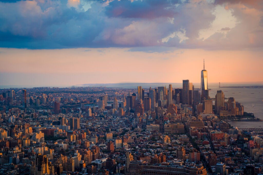 An aerial view of Manhattan with nice evening light and clouds overhead.