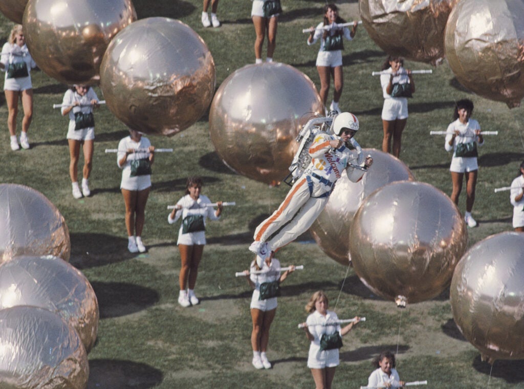 Bill Suitor uses a jetpack to hover over the opening ceremony for the 1984 Olympic Games at the Los Angeles Memorial Coliseum.